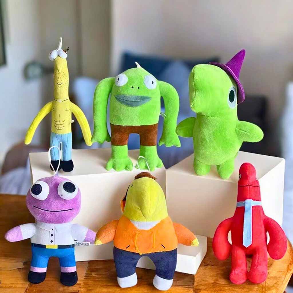 A group of six brightly colored character plush toys displayed on white blocks and a wooden table in a room setting.