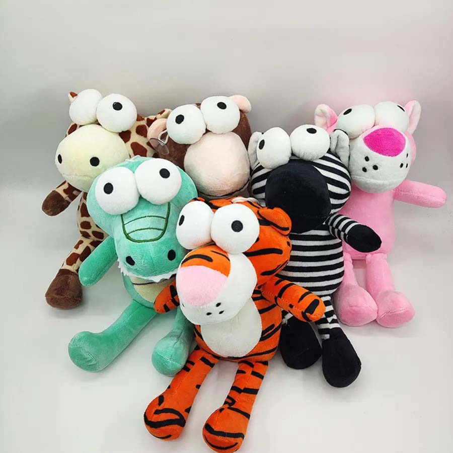 A group of colorful plush animals with oversized cartoon eyes, including a giraffe, crocodile, tiger, monkey, zebra, and pink panther.