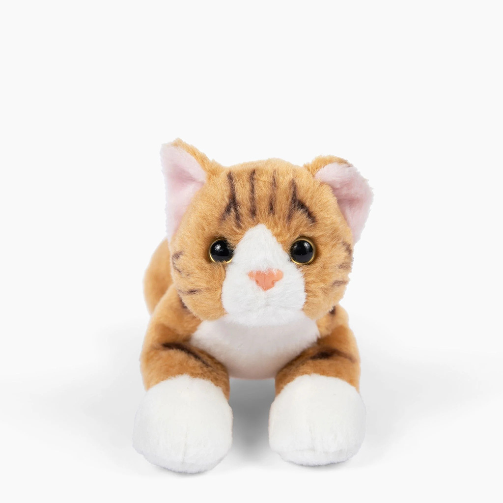 A cute orange tabby cat plush toy with white paws, a white muzzle, a pink heart-shaped nose, and large round eyes, posed lying forward on a clean white background.