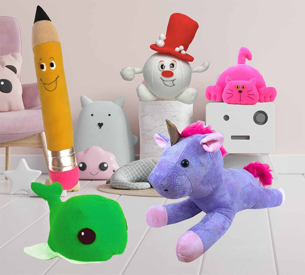 A playful assortment of colorful plush toys arranged in a kids’ room, including a smiling pencil plush, a snowman with a red hat, a bright pink cat, a green whale, and a purple unicorn, displayed with pastel décor and soft cushions.