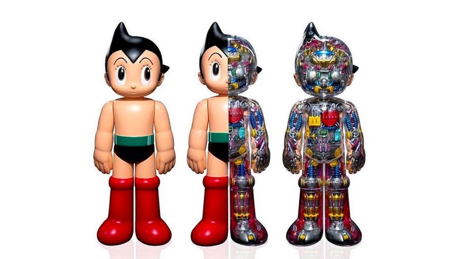 Astro Boy collectible art toy featuring a half-and-half design with one side in classic cartoon style and the other side showing detailed mechanical inner anatomy, displayed in four angles.