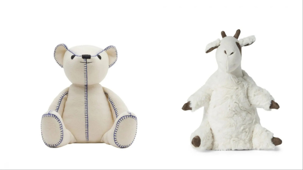 Two cream-colored plush toys—a stitched minimalist teddy bear and a fluffy goat with brown accents—sitting upright on a white background for product display.