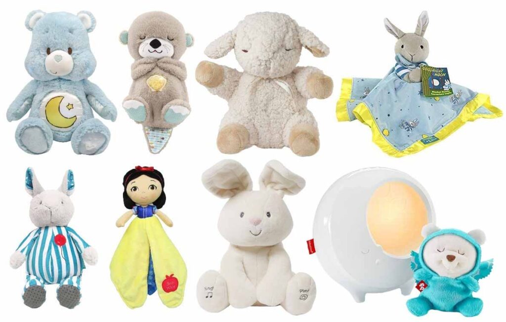 A collection of soft baby plush toys, including bears, bunnies, lambs, comfort blankets, character dolls, and a night-light plush, arranged together on a white background.