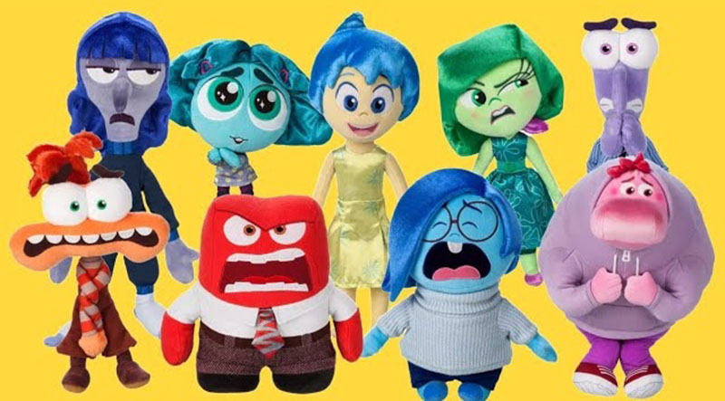 A colorful group of Inside Out movie plush toys featuring characters such as Joy, Sadness, Anger, Fear, Disgust, and others, arranged together against a bright yellow background.