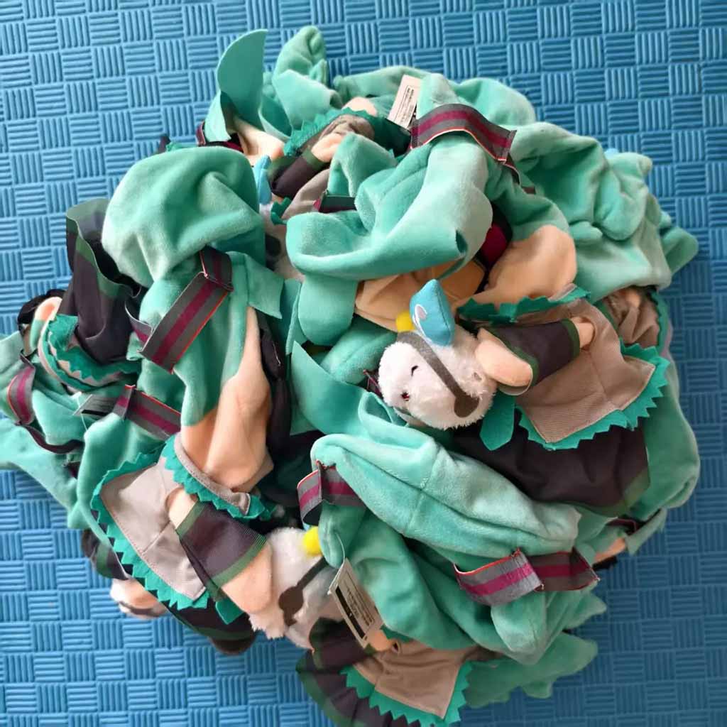 Colorful fleece pet snuffle mat with layered fabric strips designed for dogs to hide treats, encouraging slow feeding, mental stimulation, nose work training, and interactive enrichment, suitable for puppies and adult dogs, washable soft fabric pet toy for indoor use.