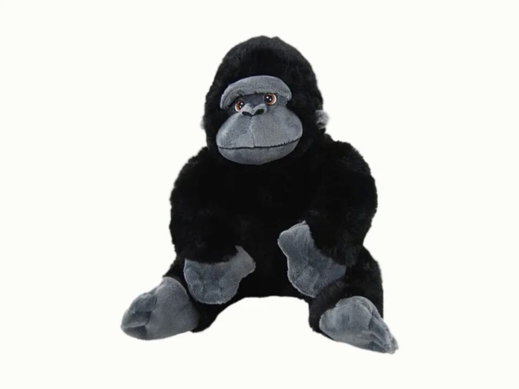 Soft plush gorilla toy with a grey face, hands, and feet, seated upright against a light background.
