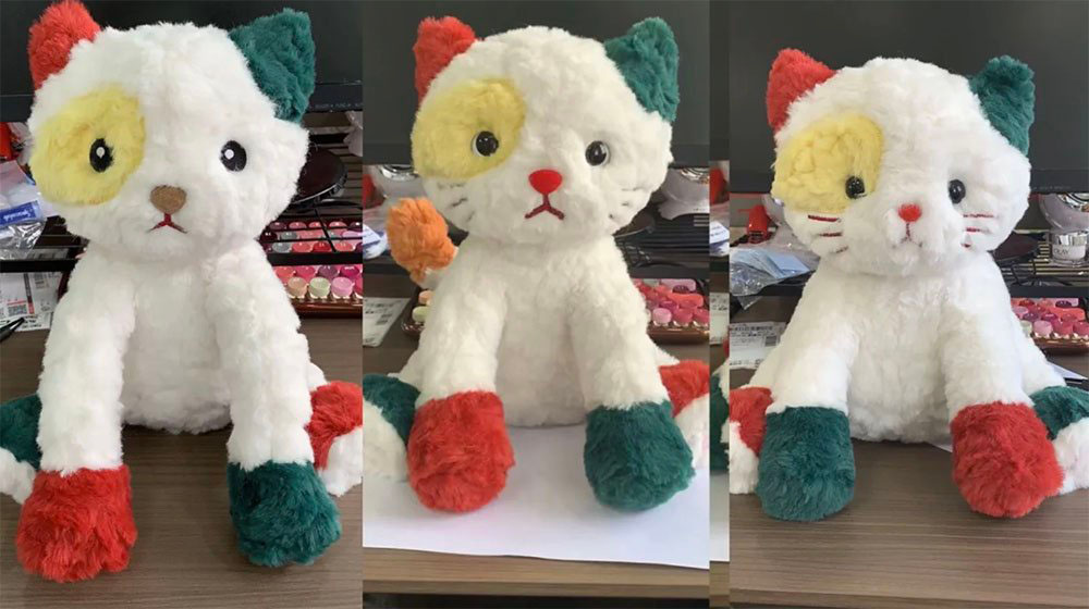 Three side-by-side photos of a white cat plush prototype showing different face and nose revisions during sample development.