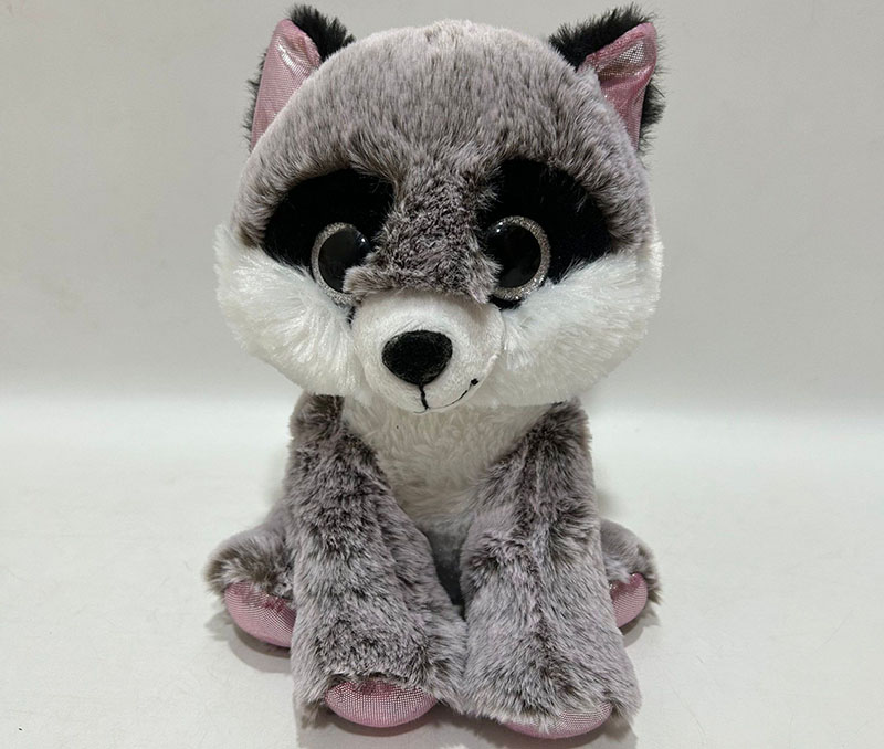 A soft sitting plush toy with oversized eyes, designed for strong visual appeal and retail display.