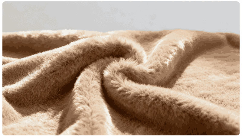 A close-up view of plush fabric, highlighting its softness, texture, and suitability for premium plush toy production.