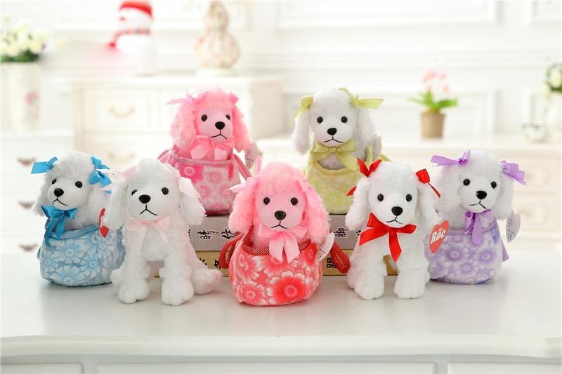 Six small poodle plush toys with ribbon bows and patterned outfits arranged on a table in a bright room.