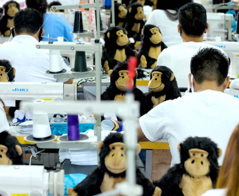 Workers sew and assemble plush toys on the production floor to ensure consistent craftsmanship and efficient output.