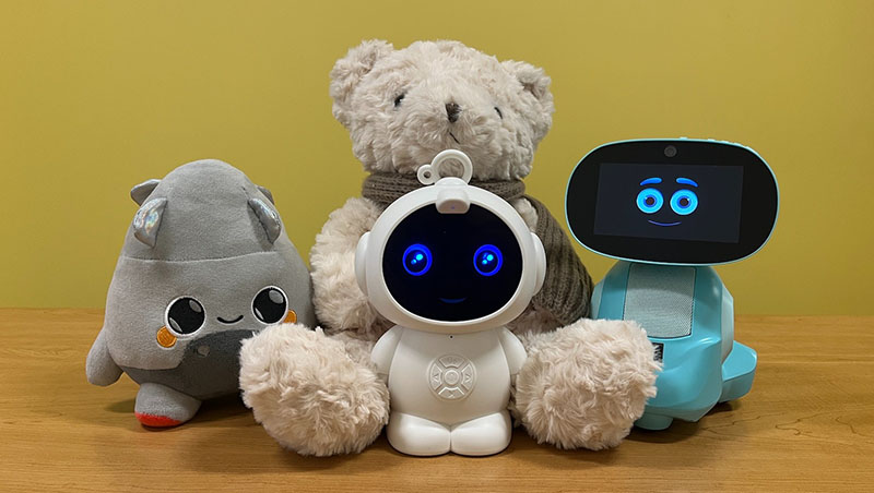 Plush toys displayed alongside smart robotic companions, highlighting the integration of soft toys with interactive technology.