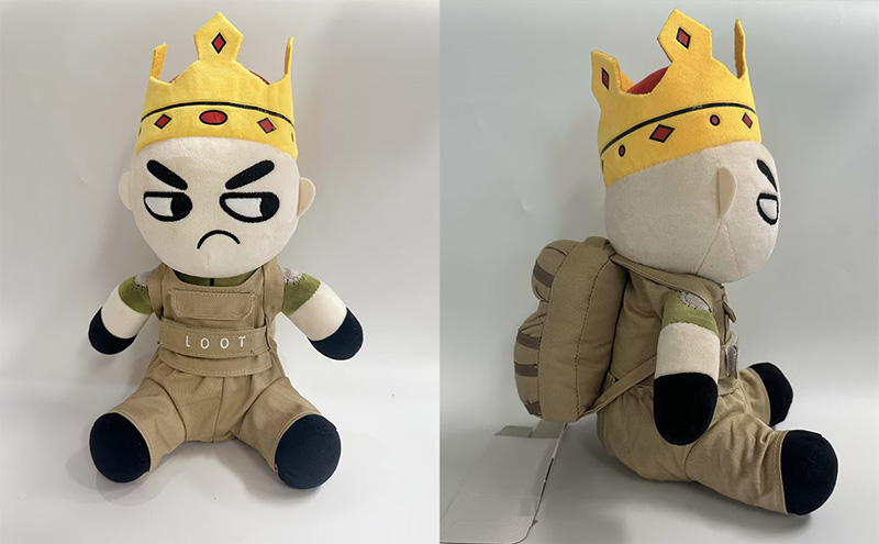 Front and side views of a custom-designed plush character wearing a crown and outfit, showcasing detailed embroidery and accessory elements.