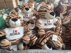 Branded tiger plush toys featuring printed shirts, produced in bulk for promotional or souvenir retail sales.