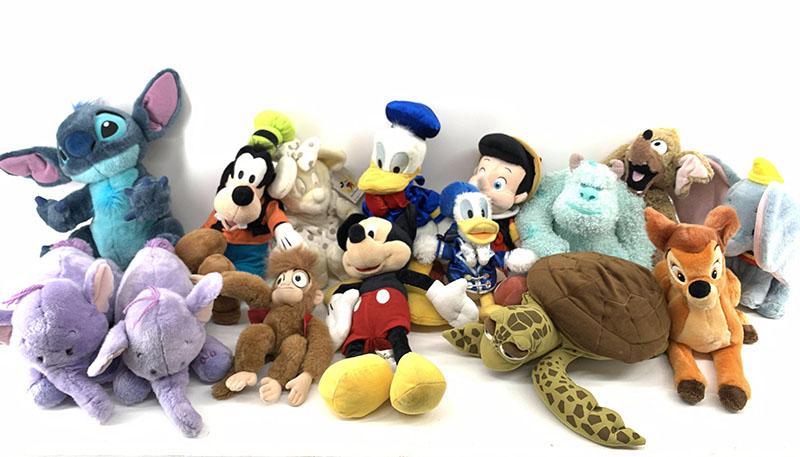 A collection of character plush toys in various designs and sizes, suitable for licensed merchandise and retail displays.
