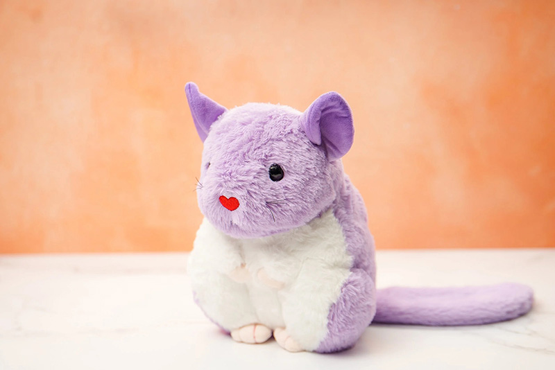 Soft purple plush mouse with white belly and long tail, featuring a cute and simple design.