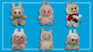 A lineup of character plush dolls displayed against a blue background, showcasing different color variations, facial expressions, and themed accessories within the same product series.