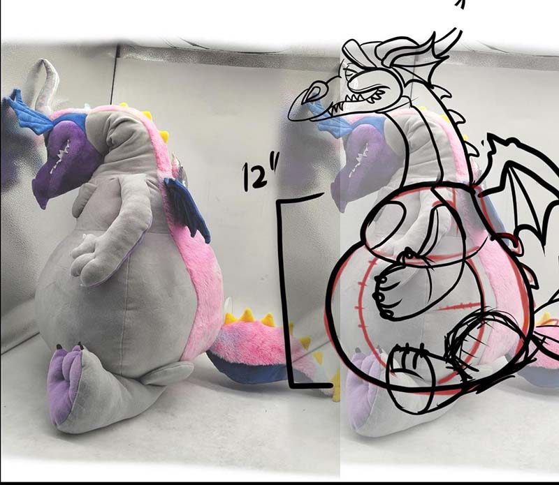 A plush dragon prototype shown alongside a hand-drawn design sketch, illustrating the development process and size reference for custom plush toy production.