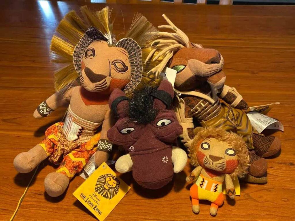 A group of themed character plush toys inspired by a popular animated franchise, featuring detailed costumes, embroidery accents, and officially styled design elements.