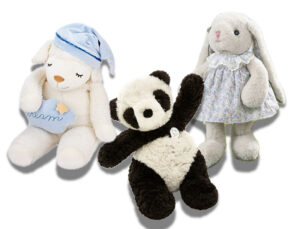 A collection of soft plush animal dolls including a sleeping lamb with a nightcap, a panda teddy, and a dressed bunny rabbit, designed as comforting toys for children or decorative plush gifts.