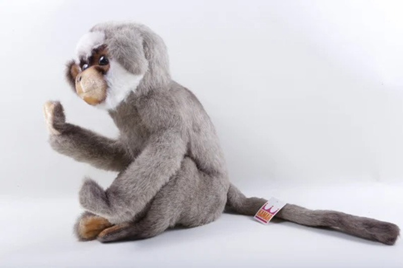 A realistic monkey plush toy with soft fur texture and long tail, designed to resemble a natural primate and suitable for educational play, decoration, or collection.