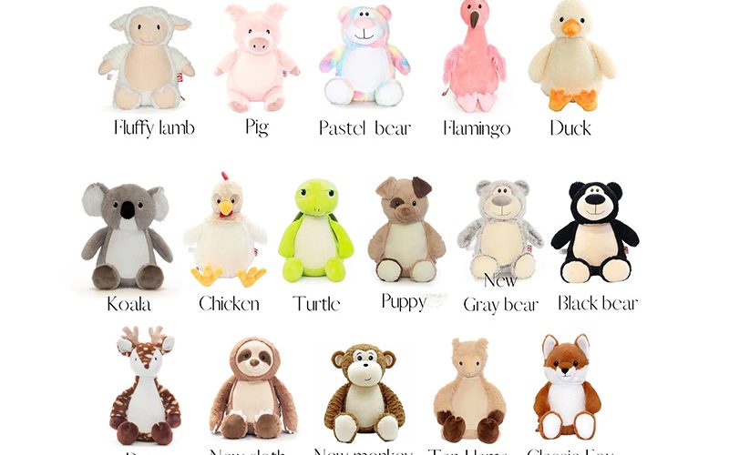 Assorted plush stuffed animals displayed in a grid, including lamb, pig, bear, flamingo, duck, koala, chicken, turtle, puppy, fox, sloth, monkey, llama, and deer