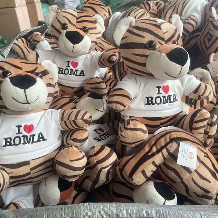 Branded tiger plush toys featuring printed shirts, produced in bulk for promotional or souvenir retail sales.