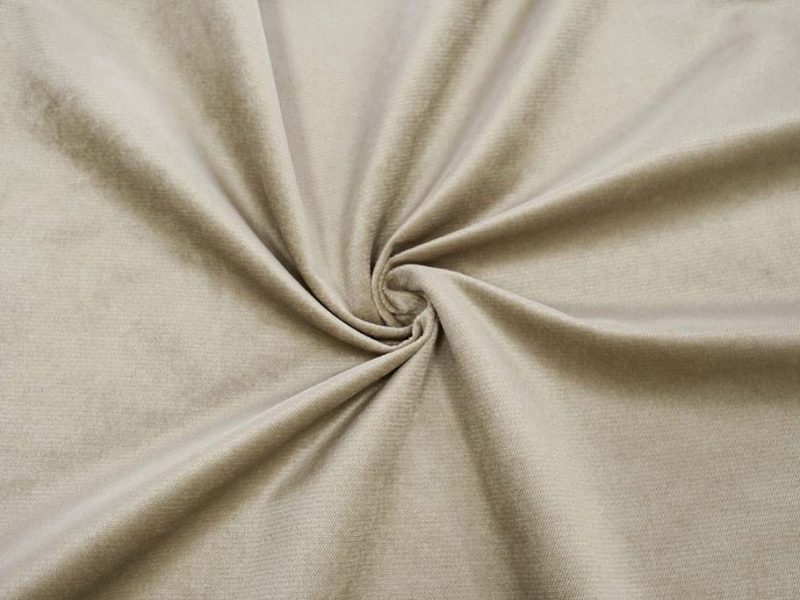 Close-up of beige velboa fabric showing its smooth, short-pile surface with gentle sheen, commonly used for plush toys and upholstery.