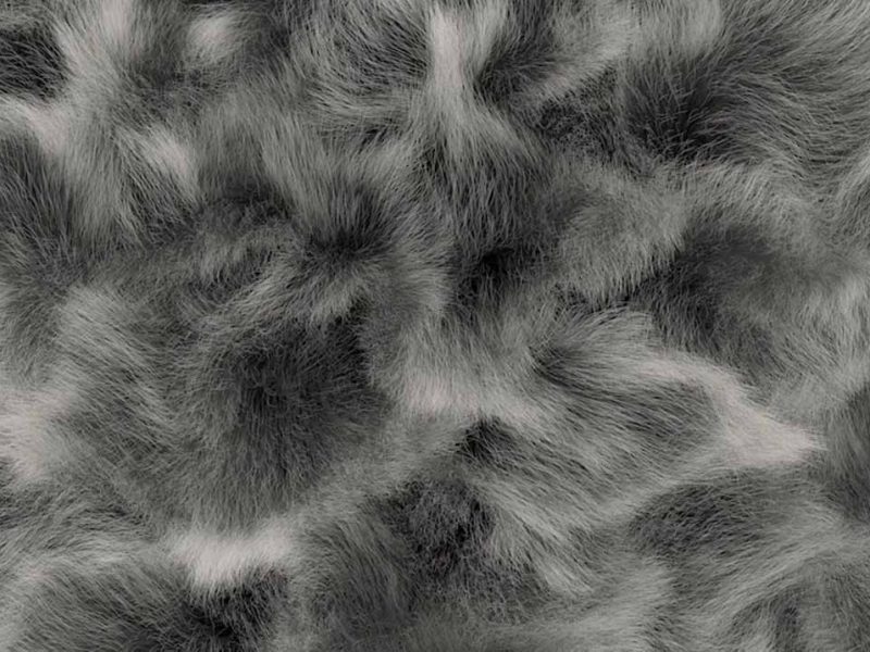 Close-up of gray faux fur fabric with a natural, multi-tone pattern and soft, fluffy texture ideal for plush toys and luxury textile products.
