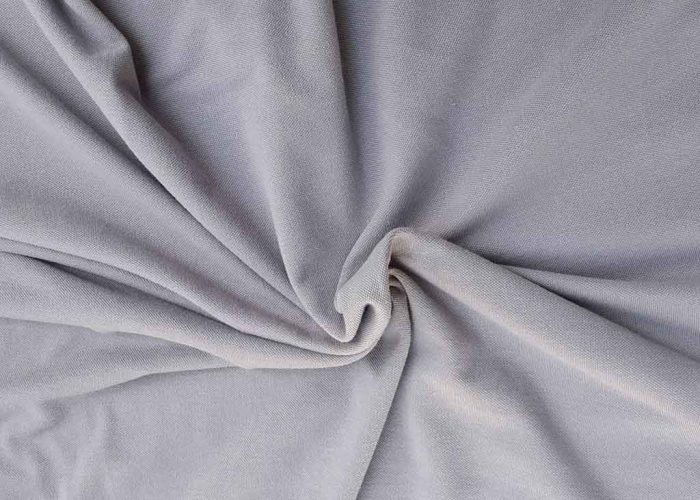 Smooth gray velboa fabric close-up showing its short, dense pile and subtle sheen, ideal for plush toys, upholstery, and soft decorative projects.